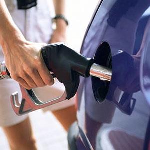 Filling fuel tank (© Corbis)